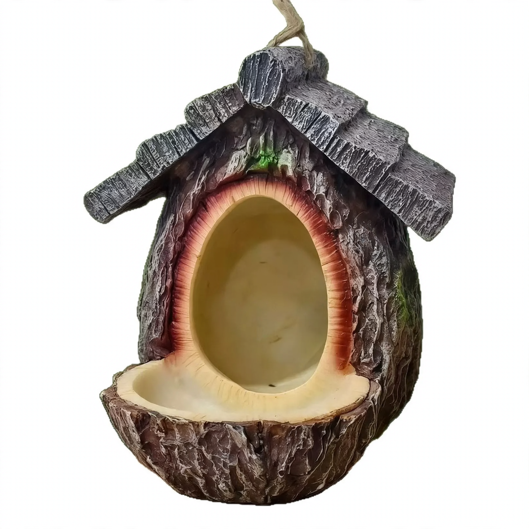 Decorative birdhouse in stump tree look made of resin