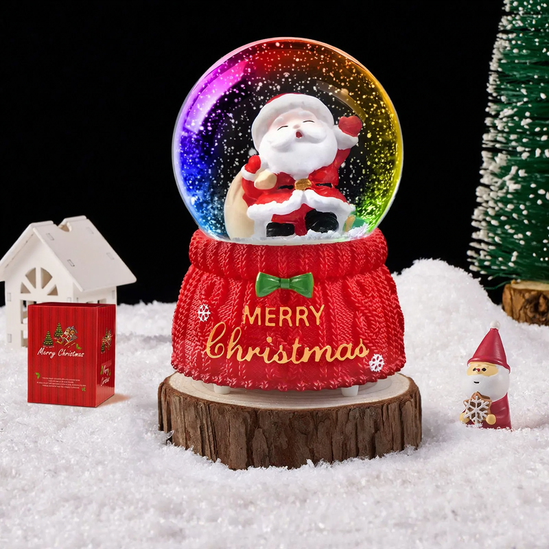 Christmas snow globe with music box and carriage design