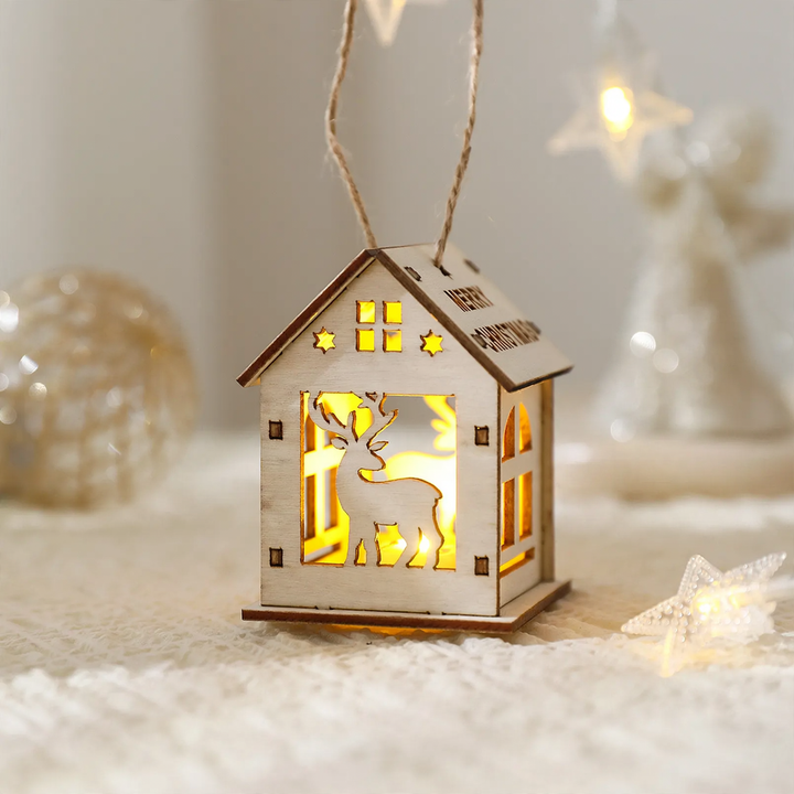 Illuminated wooden house as Christmas decoration