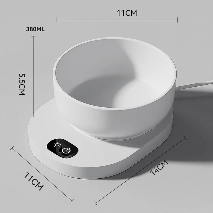 Heated drinking and feeding bowl for pets