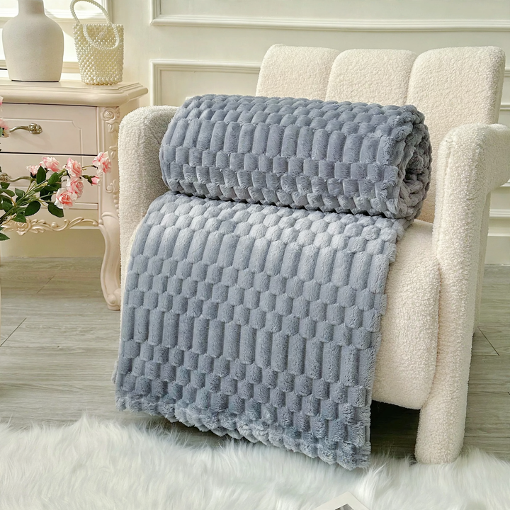 Versatile living blanket with jacquard pattern