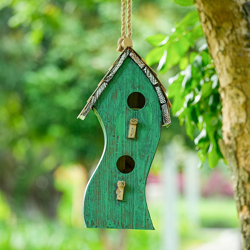Wall-mounted birdhouse made of pine wood