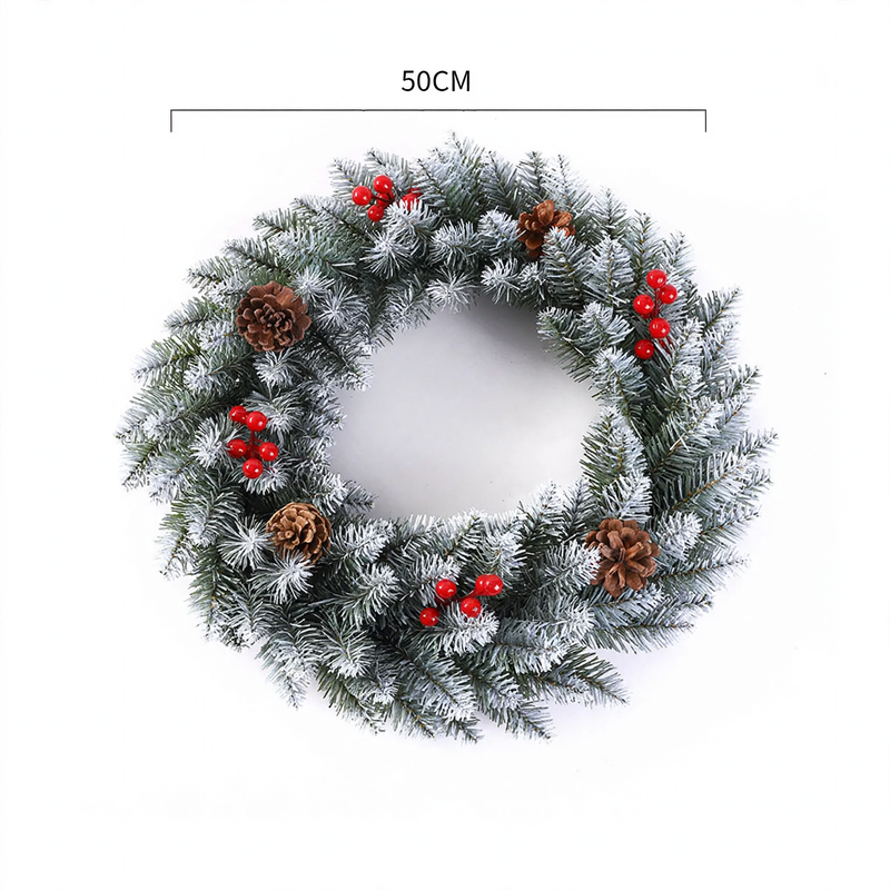 Christmas wreath with berries and pine cones