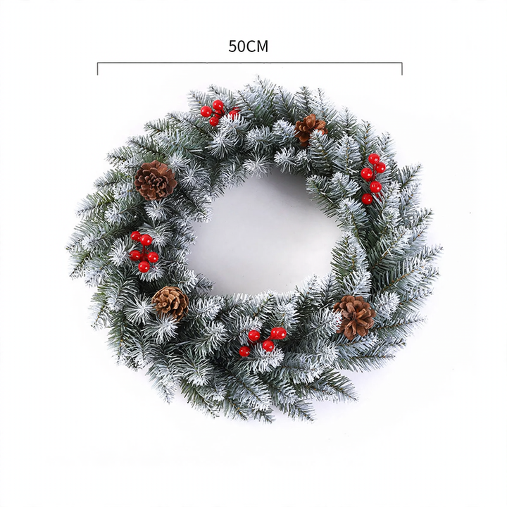 Christmas wreath with berries and pine cones
