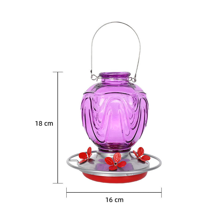 Glass bird feeder for the garden