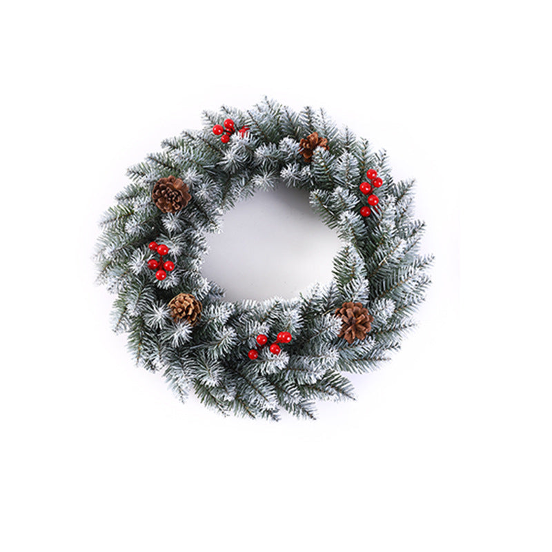 Christmas wreath with berries and pine cones