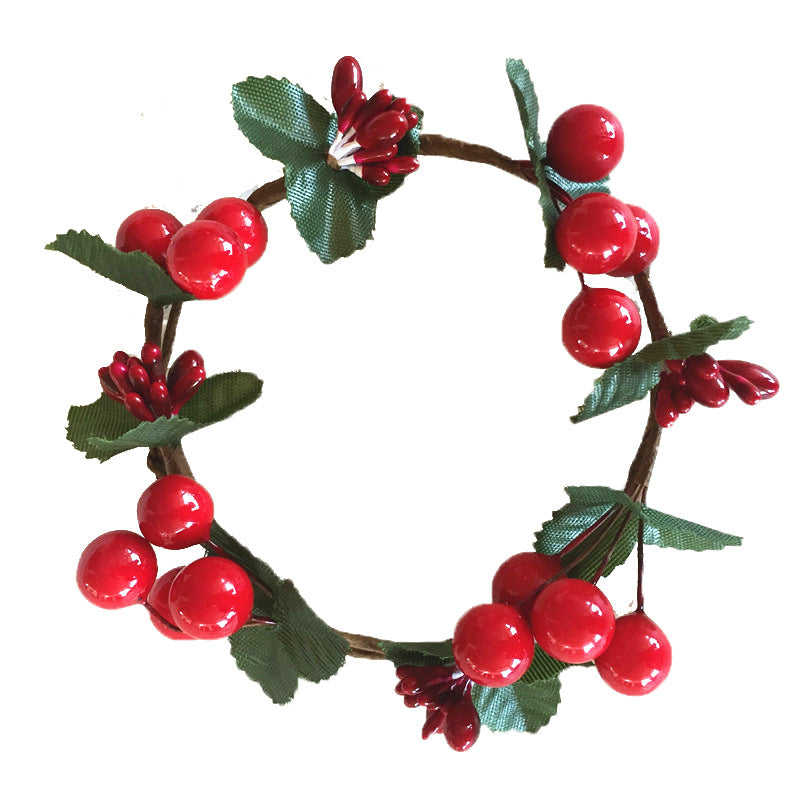 Christmas candle wreath with red berries