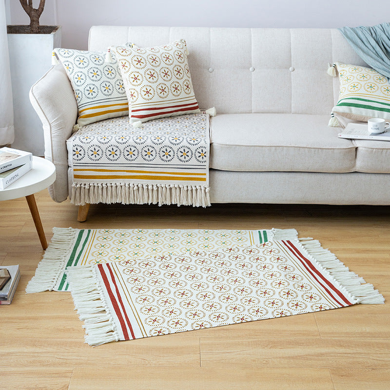 Flat woven cotton runner with fringes and graphic medallion pattern