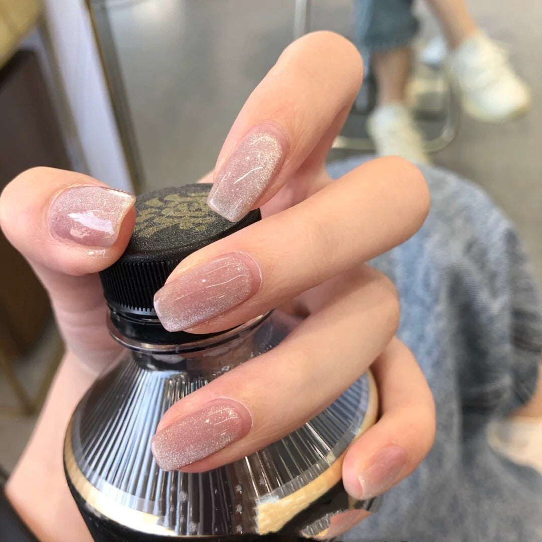 Artful nail art with a gentle glitter effect and elegant finish Bowlift