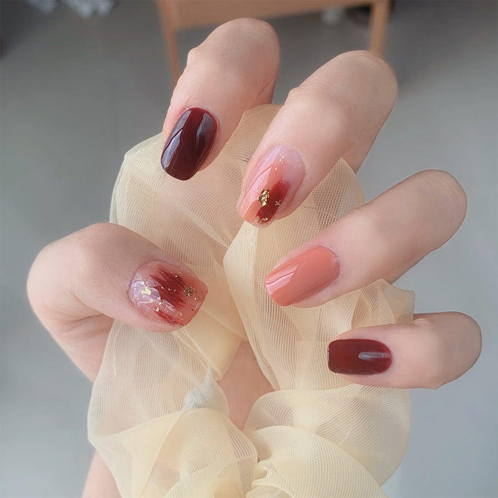 Artificial Nail Art with Gold Decorations Bowlift