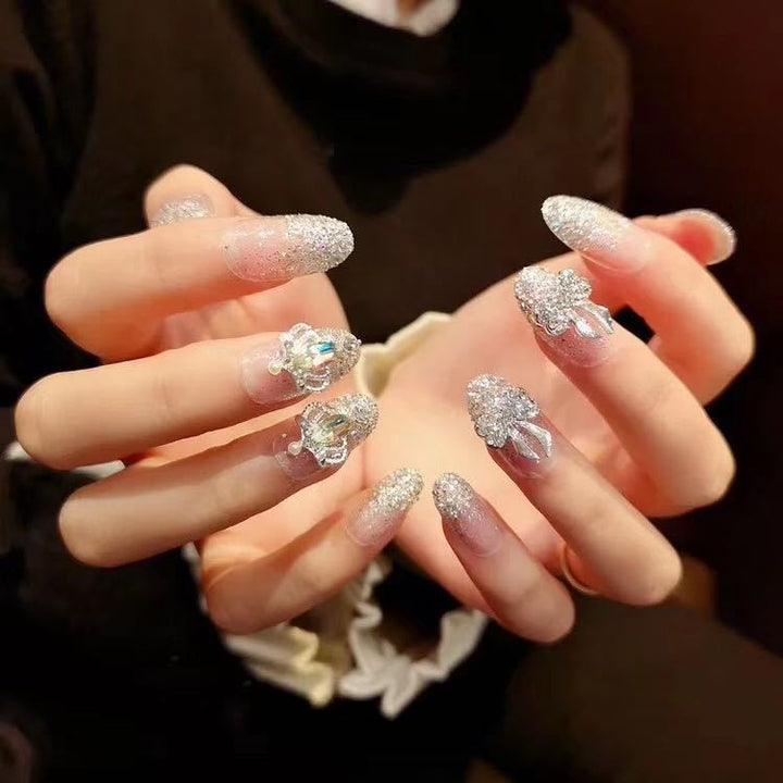 Nail art with sparkling rhinestone and glitter accents Bowlift