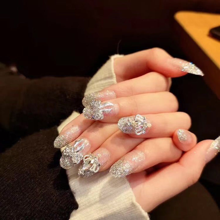Nail art with sparkling rhinestone and glitter accents Bowlift