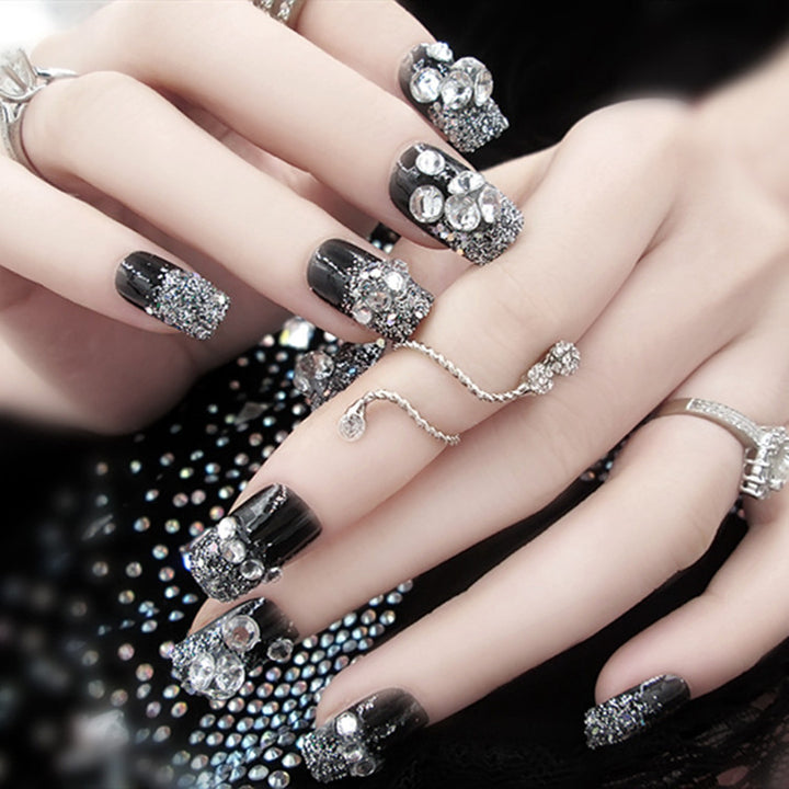 Artificials nails with sparkling rhinestone accents and elegant flower embellishments Bowlift