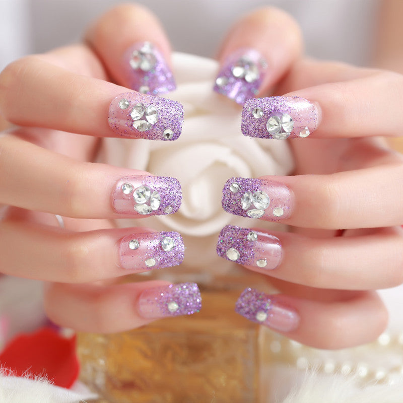 Artificials nails with sparkling rhinestone accents and elegant flower embellishments Bowlift