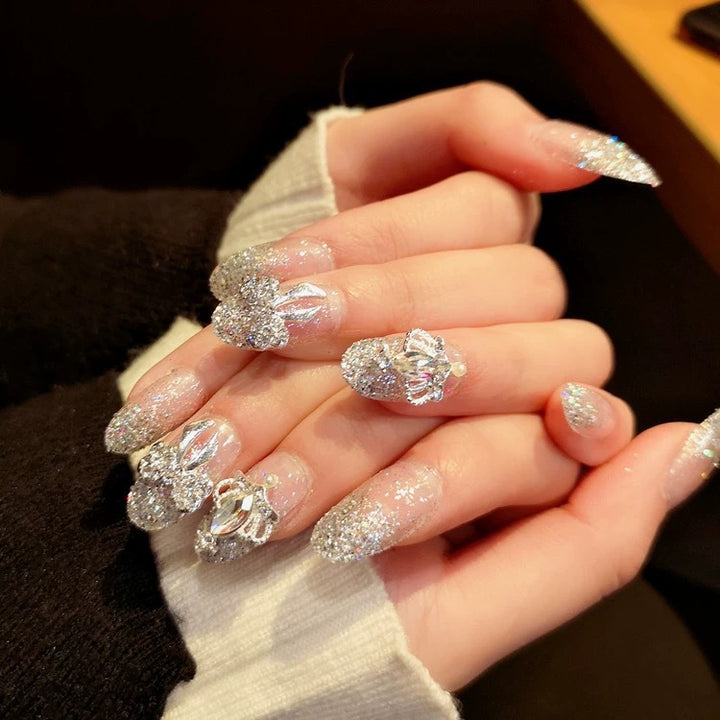 Nail art with sparkling rhinestone and glitter accents Bowlift