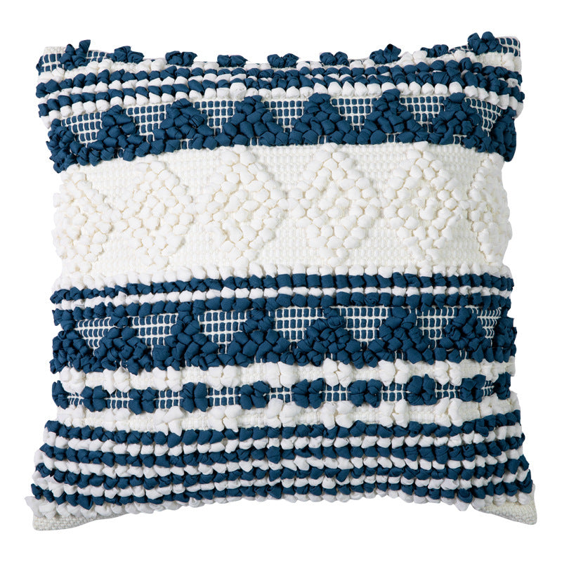 Square woven decorative cushion cover with crocheted appliqués and textured relief