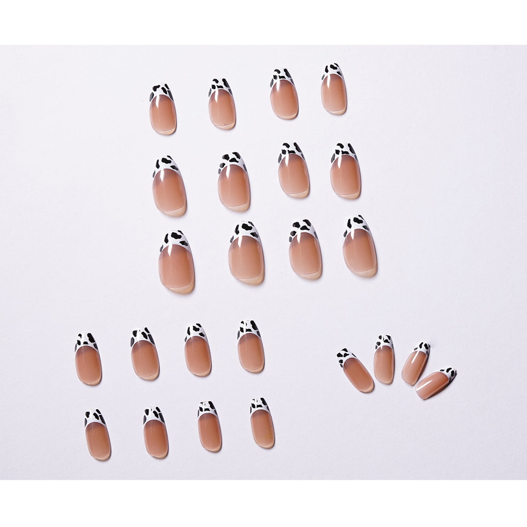 Stylish nail extensions in modern cow print style Bowlift