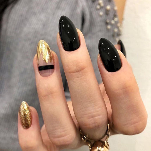 Artistic Nail Extensions with Black Gloss and Elegant Accents Bowlift