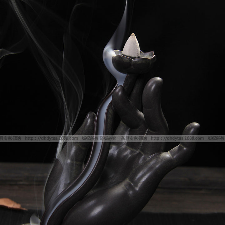 Hand-shaped ceramic incense holder