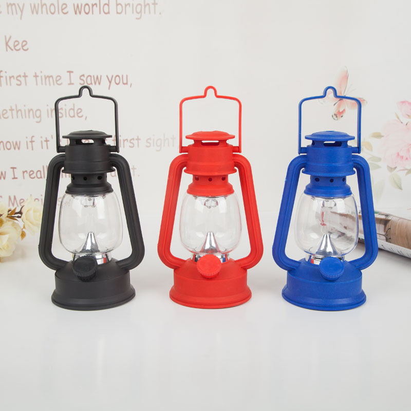 Portable rechargeable LED hurricane lantern with hanging handle and clear glass globe Bowlift