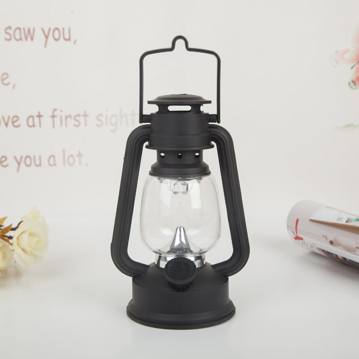 Portable rechargeable LED hurricane lantern with hanging handle and clear glass globe Bowlift