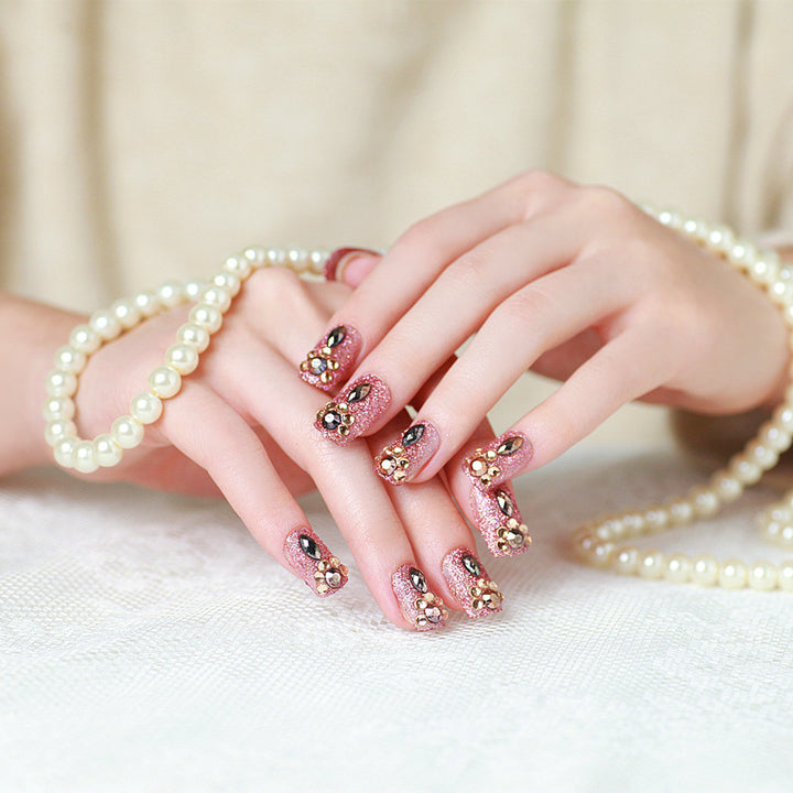 Glamorous artificial nails with glitter and jewelry decoration Bowlift