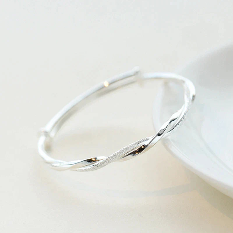 Elegant Twisted Silver Bracelet Bowlift