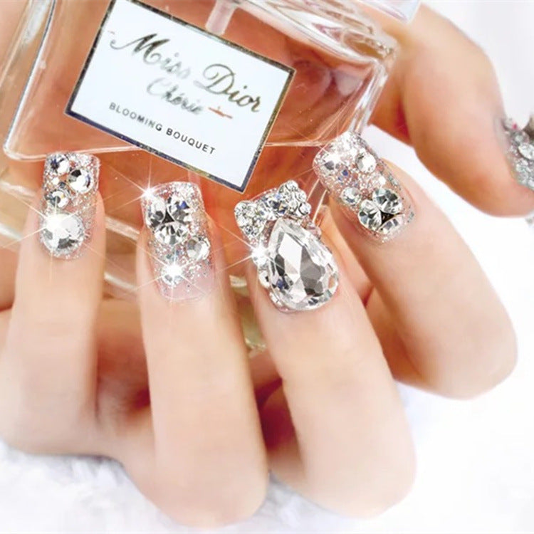 Nail art with glamorous rhinestone and glitter design Bowlift
