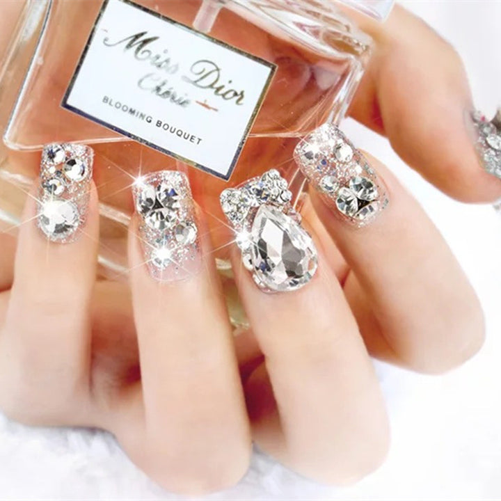 Nail art with glamorous rhinestone and glitter design Bowlift
