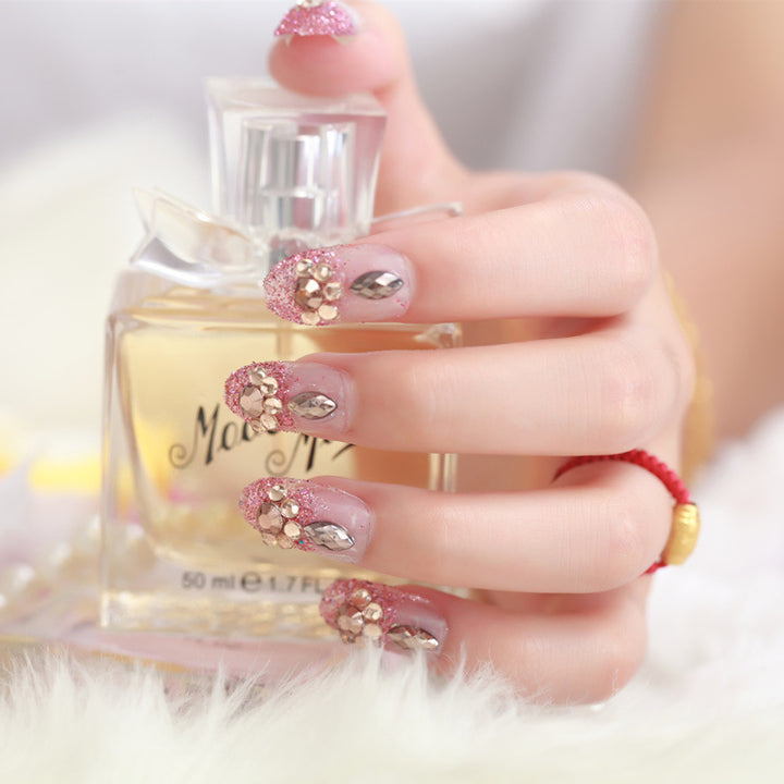 Glamorous artificial nails with glitter and floral elements Bowlift