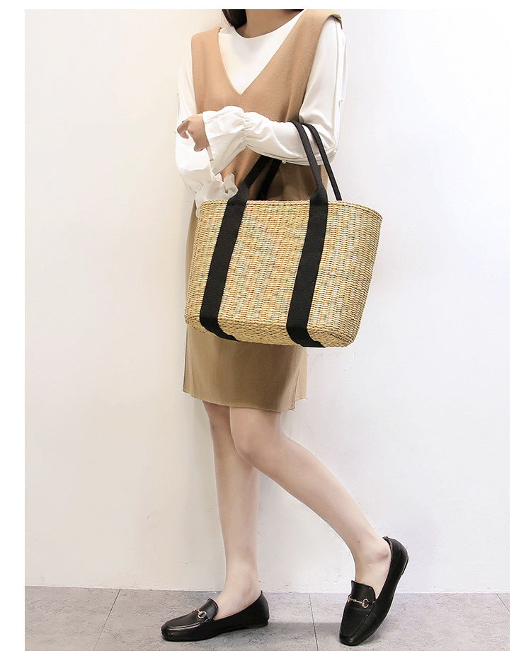 Spacious straw tote bag with comfortable, reinforced handles Bowlift