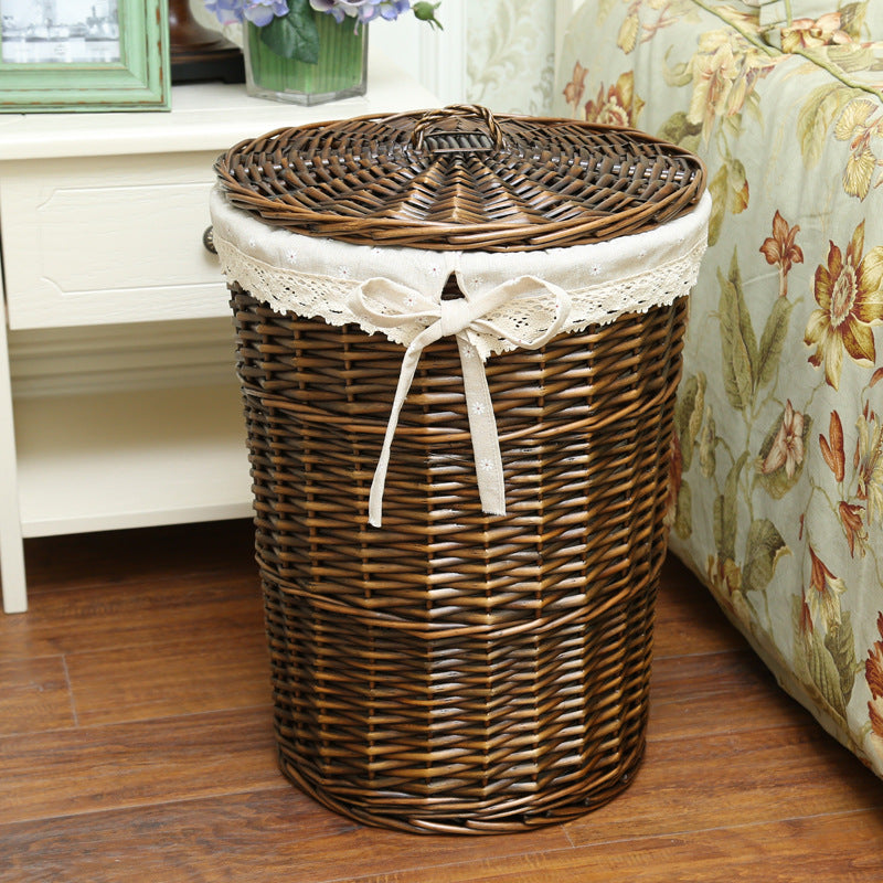 Women's laundry basket made of woven natural material with decorative fabric lining Bowlift