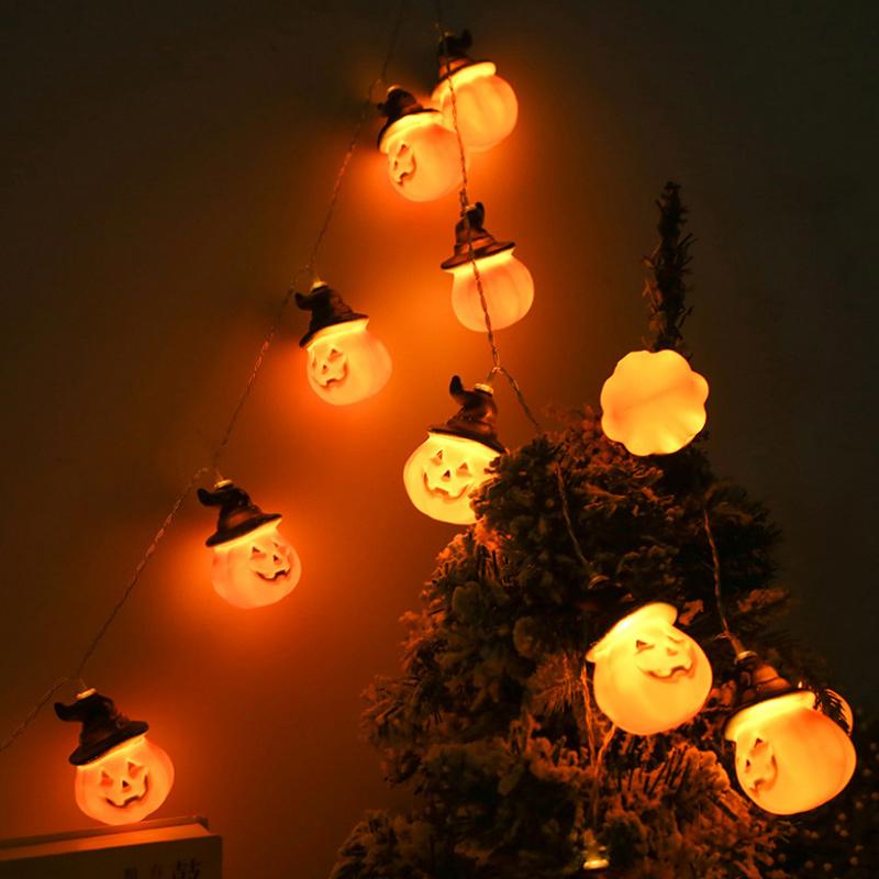 Glowing pumpkin garland Halloween with witch hats | Bowlift