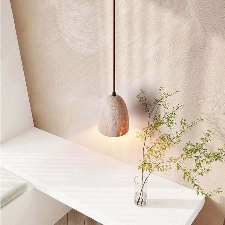 BowLift | TerraLume – Pendant light with natural stone texture and warm glow