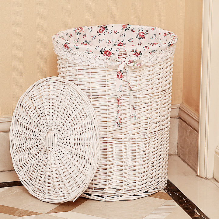 Women's laundry basket made of woven natural material with decorative fabric lining Bowlift