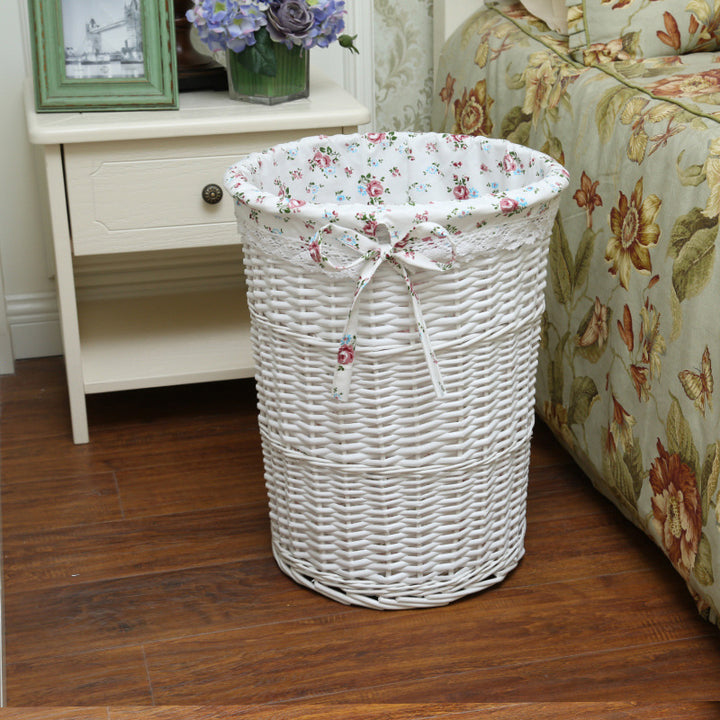Women's laundry basket made of woven natural material with decorative fabric lining Bowlift
