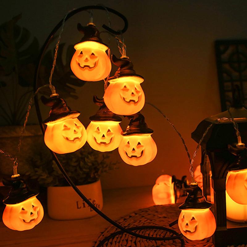 Glowing pumpkin garland Halloween with witch hats | Bowlift