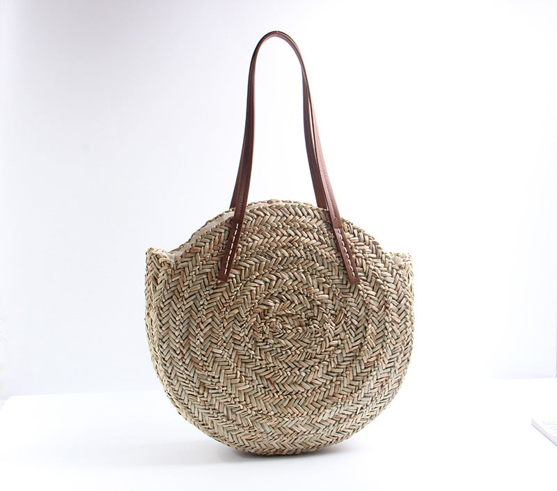 Braided straw beach bag with elegant leather handles Bowlift