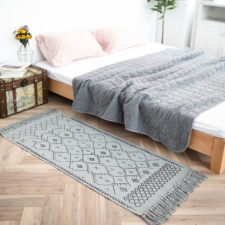 Woven cotton rug runner with flat weave structure, graphic diamond ethnic pattern and fringes