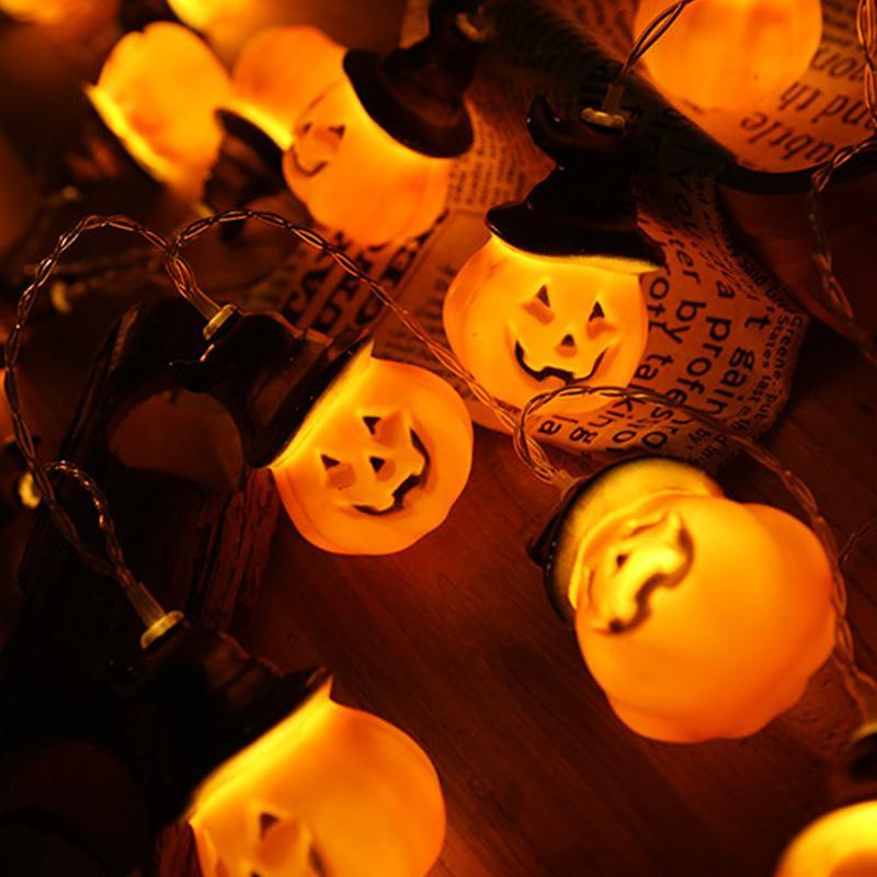 Glowing pumpkin garland Halloween with witch hats | Bowlift