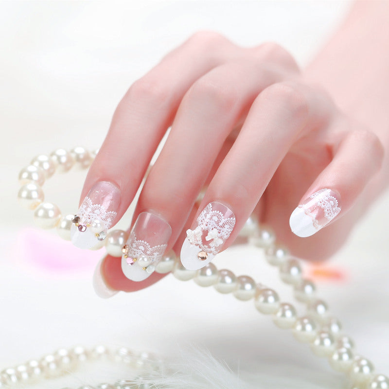 Elegant artificial nails with tip pattern and pearl embellishment Bowlift