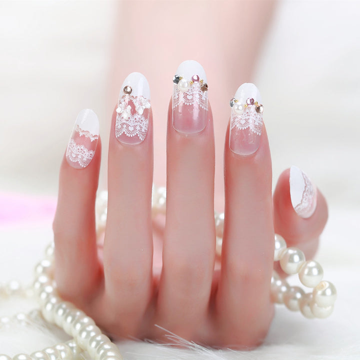 Elegant artificial nails with tip pattern and pearl embellishment Bowlift