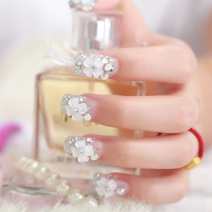 Artificial nails with glitter and floral 3D accents Bowlift