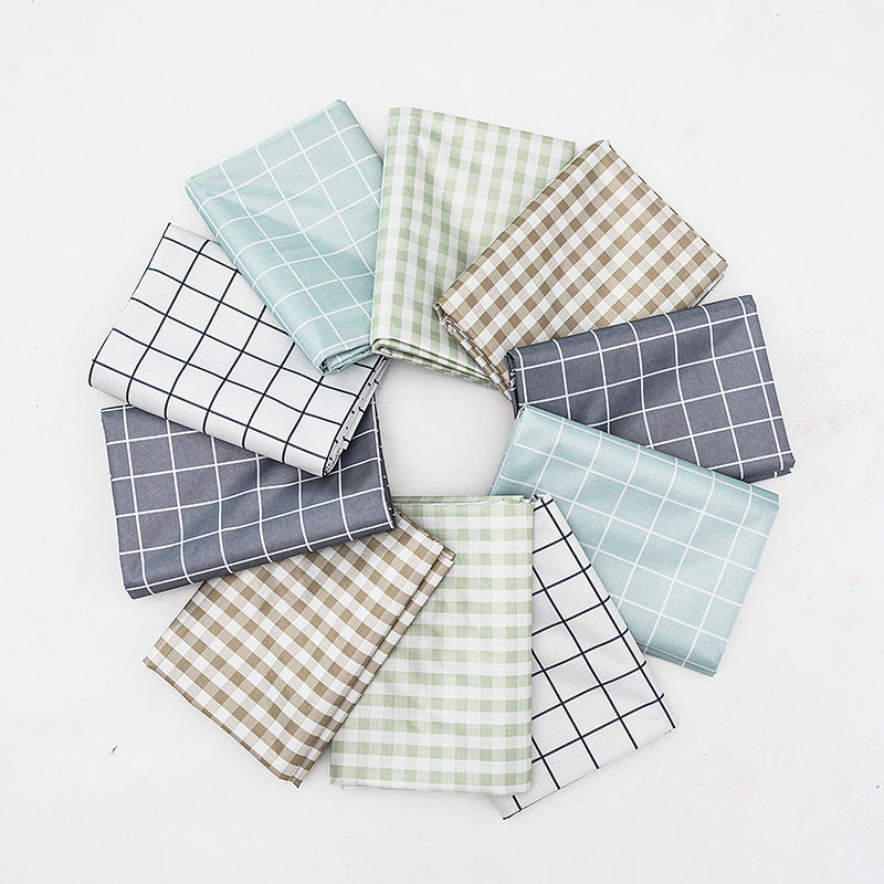 Wipeable tablecloth with fine check pattern, wavy hem and easy-care PVC finish Bowlift
