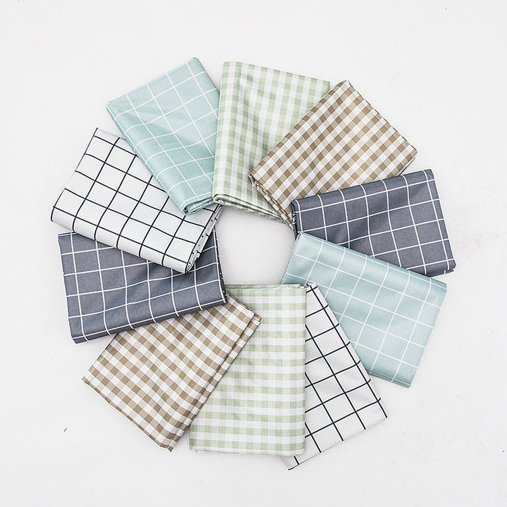 Wipeable tablecloth with fine check pattern, wavy hem and easy-care PVC finish Bowlift