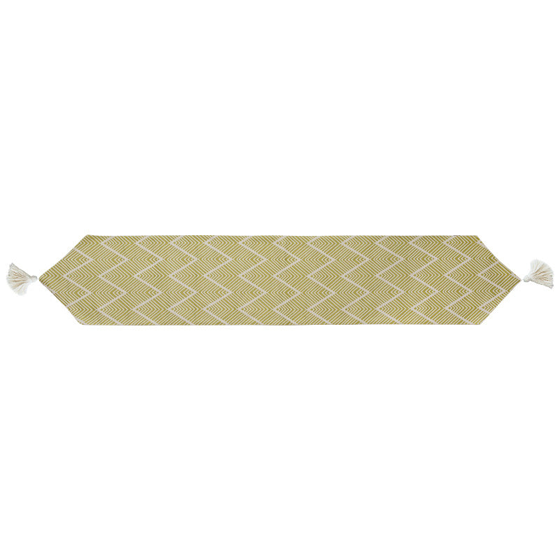 More modern woven table runner made of cotton blend with chevron jacquard and tassels
