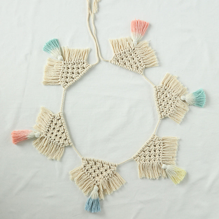 Macrame garland with hand-knotted triangle pendants and colorful cotton tassels