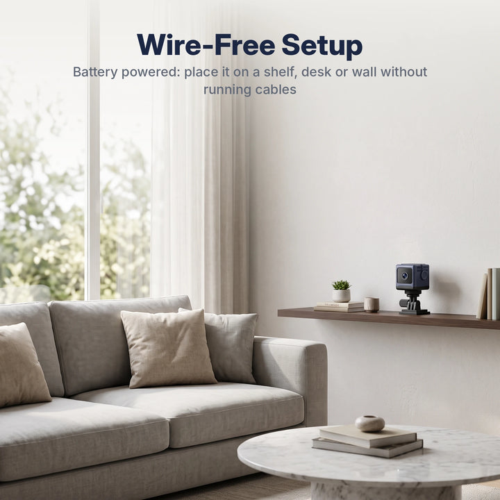 Wire-free mini camera on a floating shelf in a living room