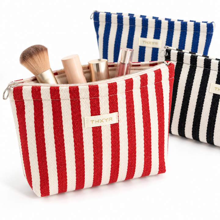 Striped canvas zippered cosmetic pouch clutch with padded lining and wristlet Bowlift