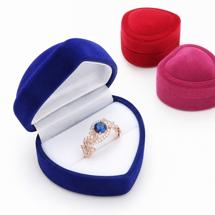 Heart-shaped velvet ring box with cushioned white interior and secure ring slot Bowlift